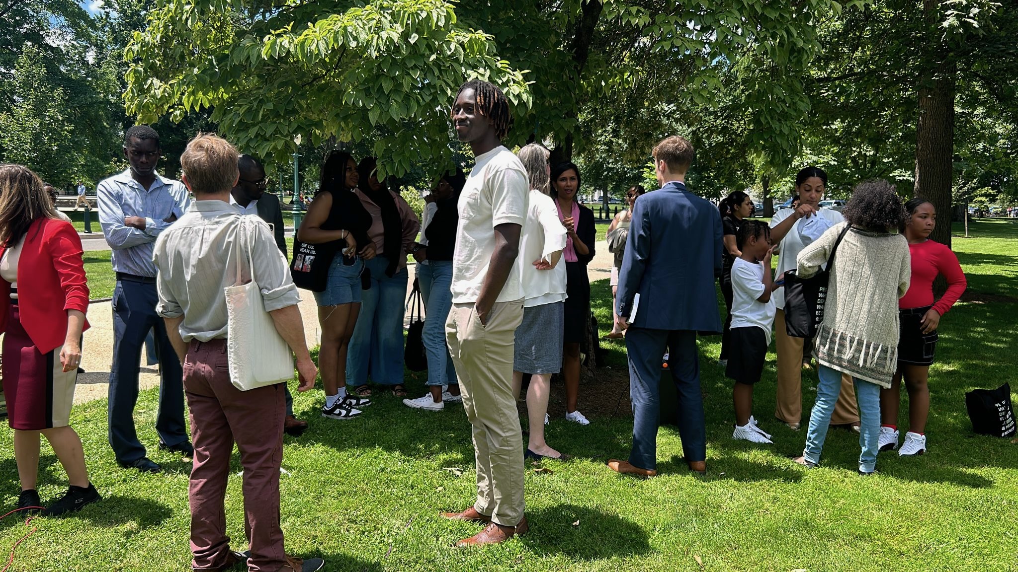 A crowd gathers to hear from people whose loved ones were deported outside of the US Capitol.